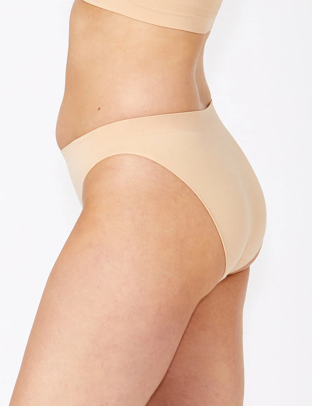 Beige seamless high-waisted Bare Essentials Bikini bottom in stretchy fabric