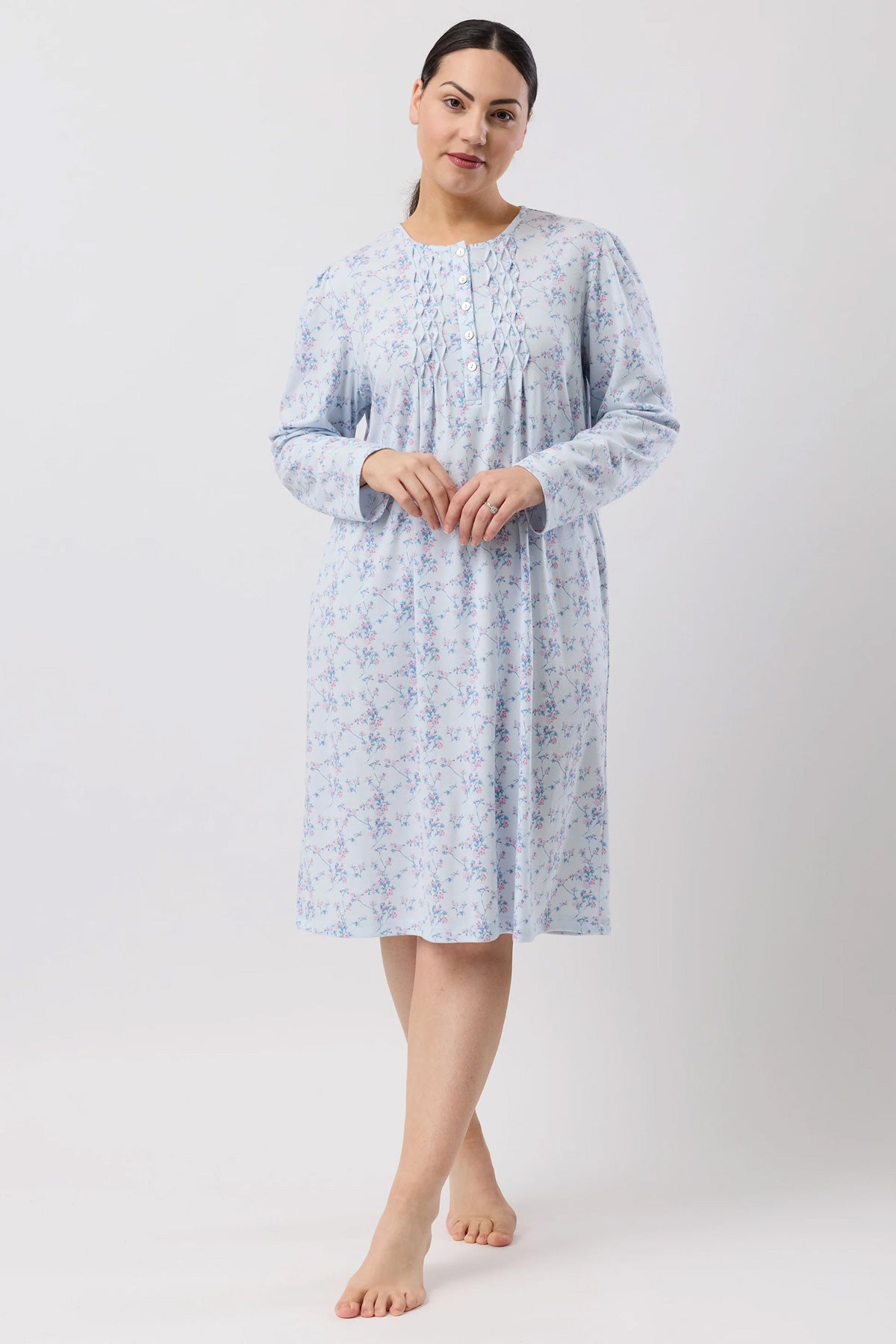 A soft light blue cherry blossom nightie with floral pattern long sleeves gathered neckline and front ruching