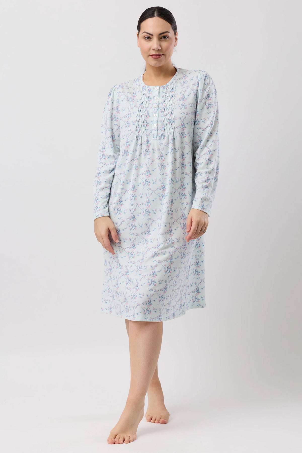 A light blue floral print cherry blossom nightie with long sleeves and a gathered neckline for comfortable sleepwear