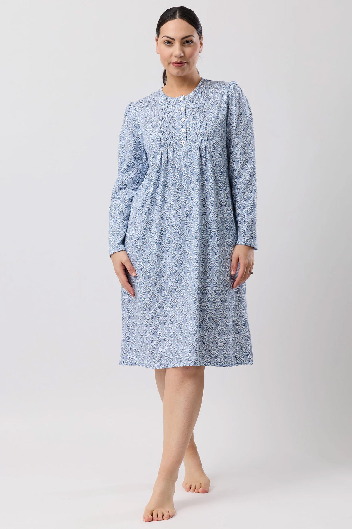 A light blue oriental smock nightie with long sleeves subtle white floral pattern and delicate embroidered neckline