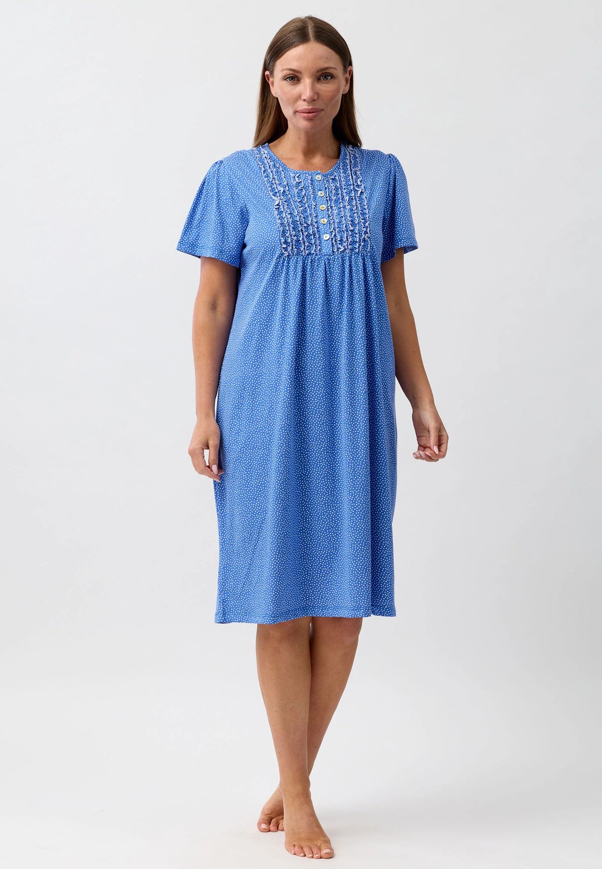 A soft blue confetti short sleeve nightie with textured fabric and delicate embroidery along the neckline