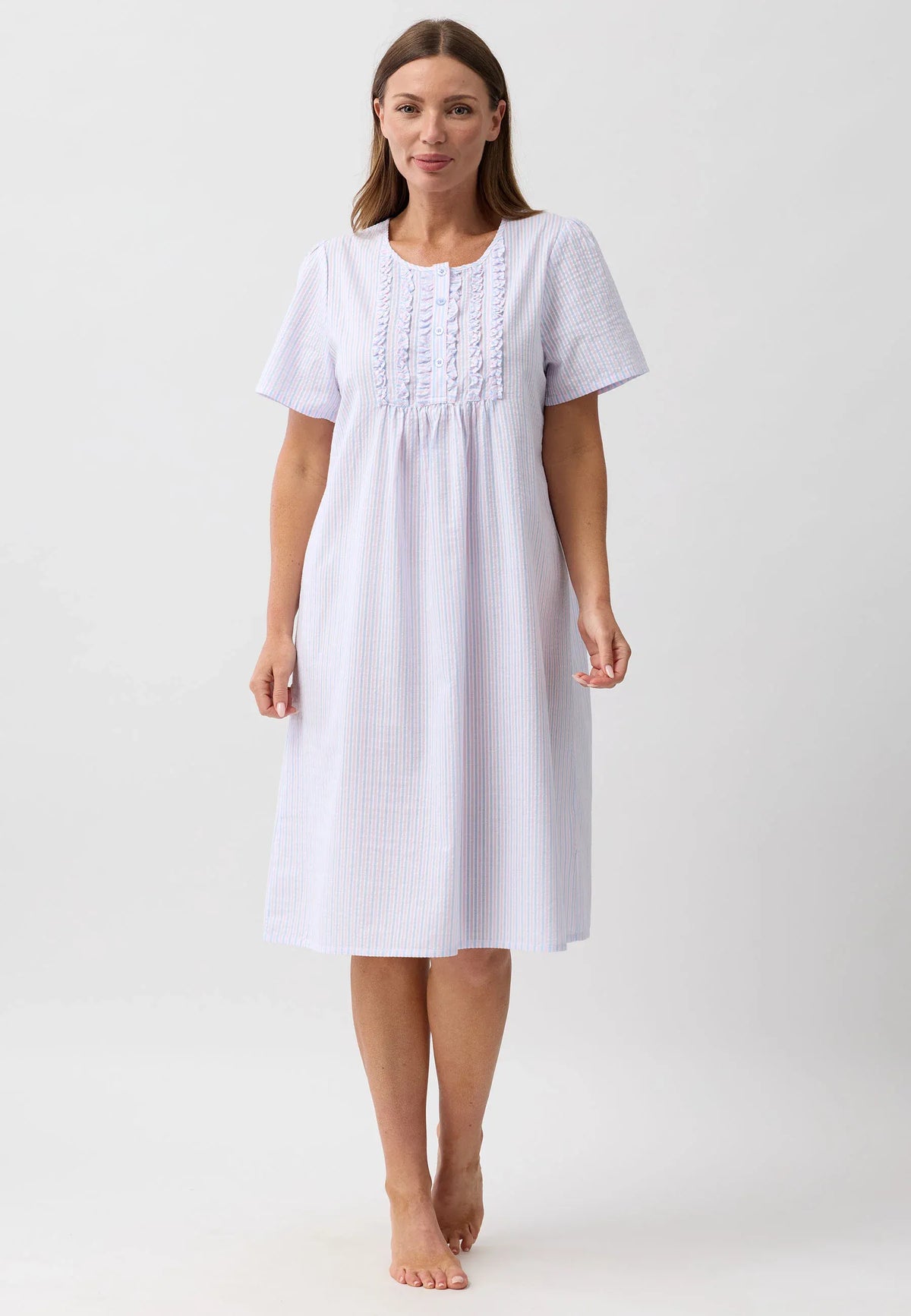 A soft light blue and white striped nightie with delicate lace trim at the neckline perfect for comfortable sleepwear