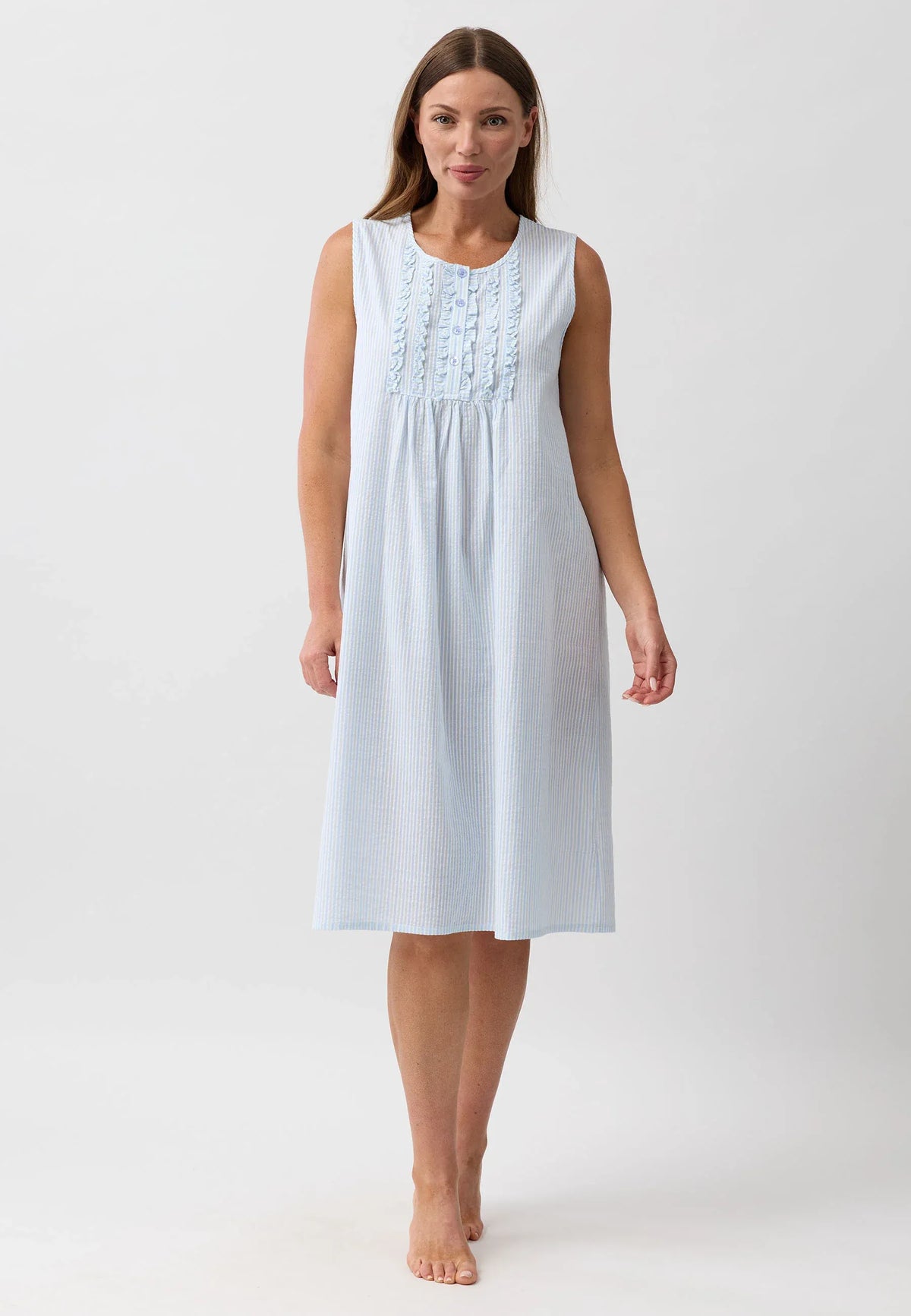 A light blue and white striped sleeveless nightie with gathered bodice and delicate lace detailing