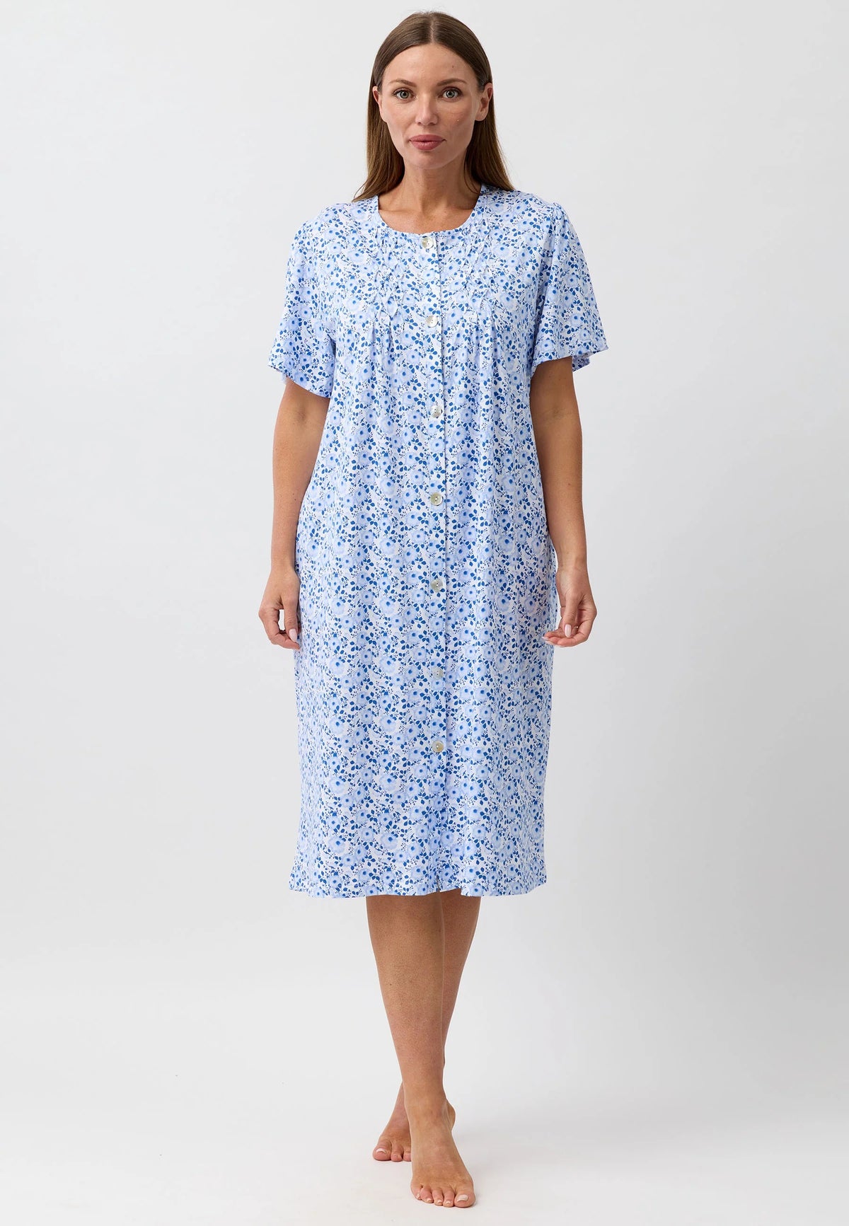 A light blue camellia brunch coat nightgown with a delicate floral pattern short sleeves and button-down front