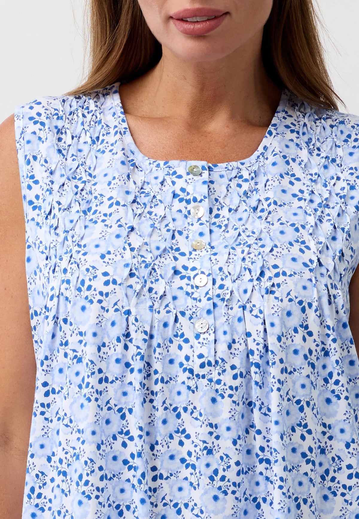 Camellia sleeveless nightie in light blue with delicate floral pattern ruffled neckline and white buttons down the front