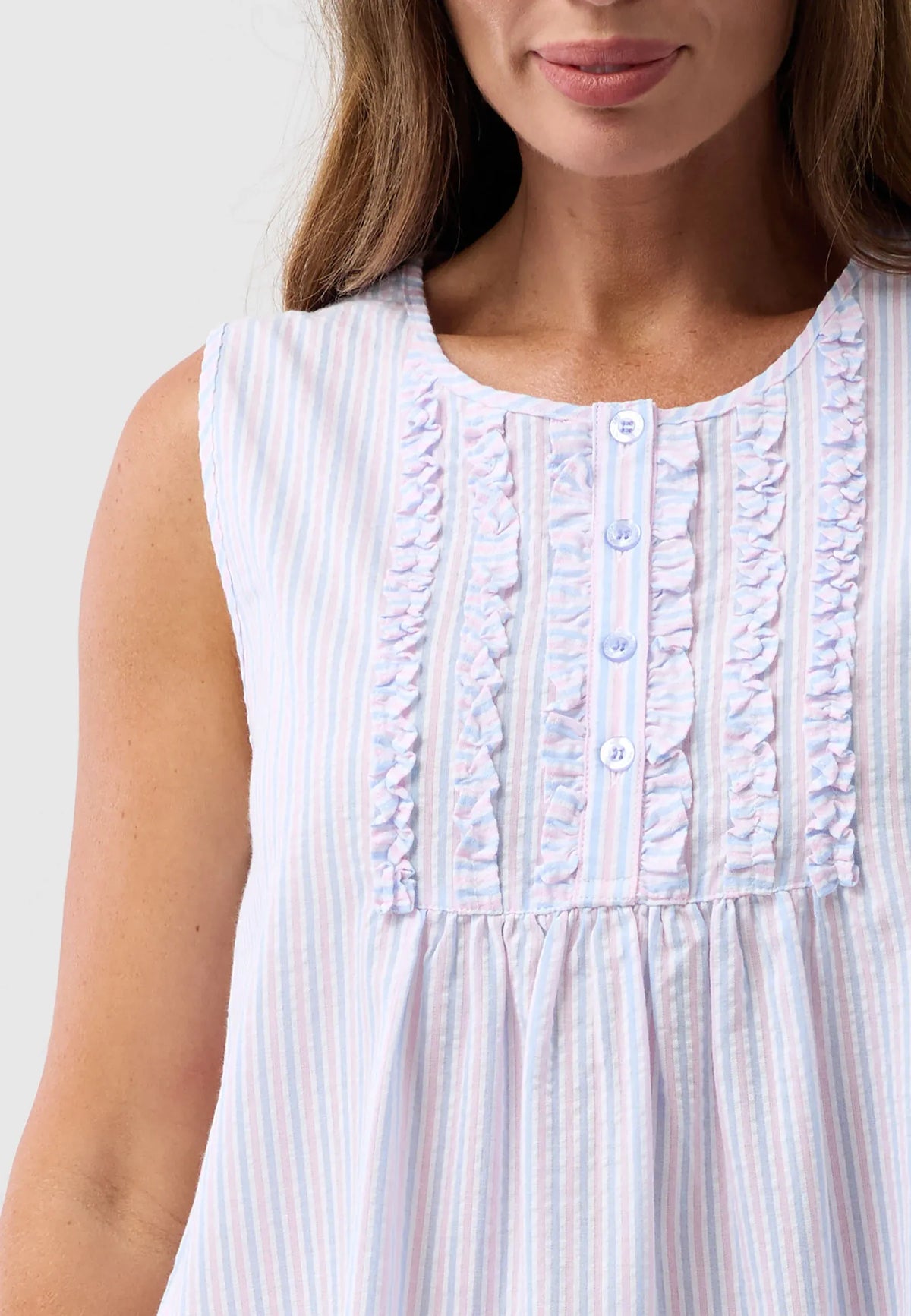 Sleeveless nightgown with soft pastel stripes and delicate ruffled neckline with button closure for comfortable sleep