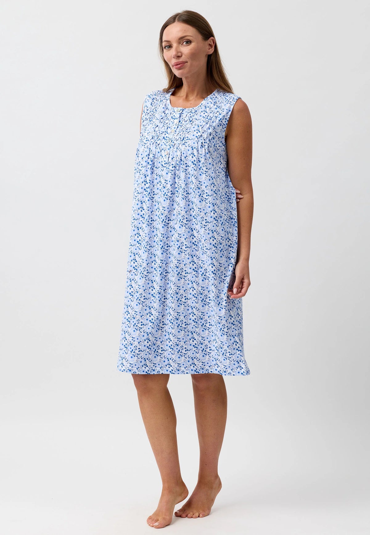 A light blue floral print camellia sleeveless nightie with gathered neckline and soft flowing fabric
