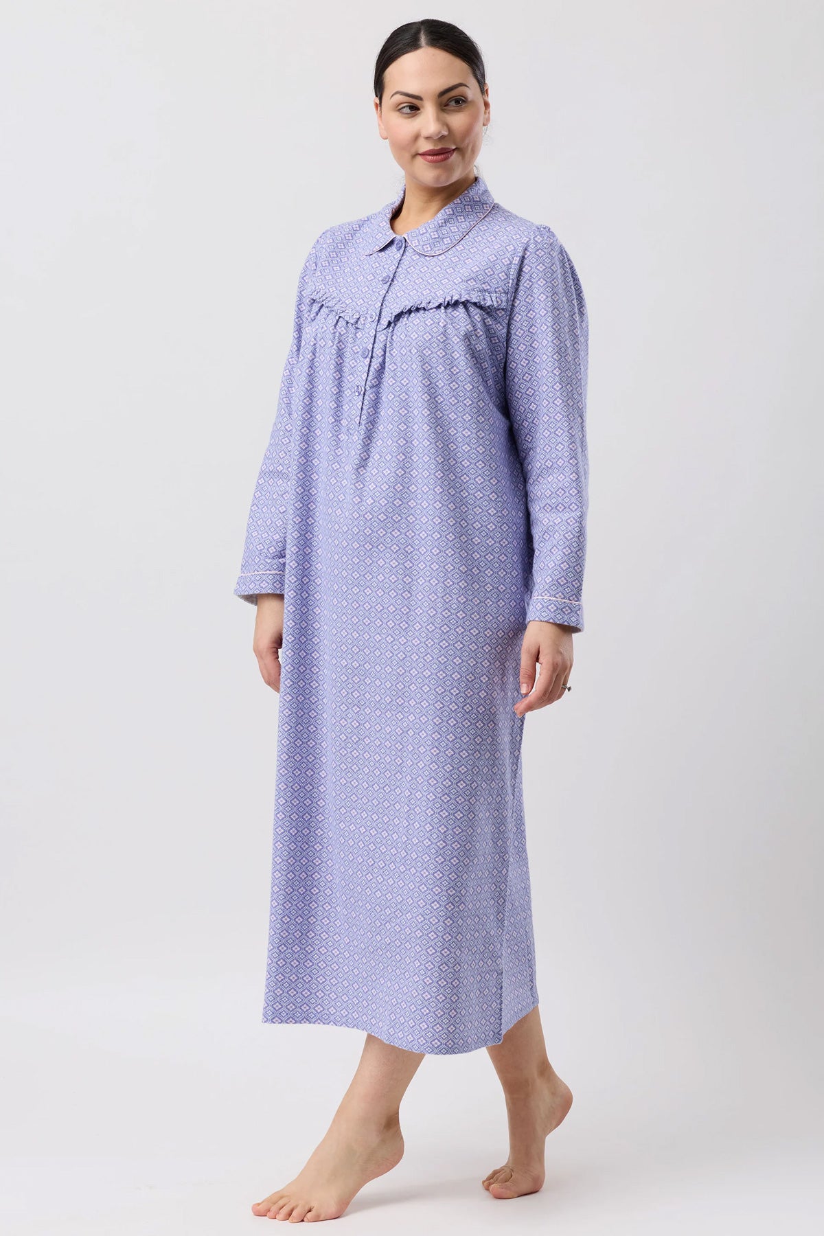 A soft lavender fleur de lys collar nightie featuring a subtle geometric pattern with long sleeves and a collar