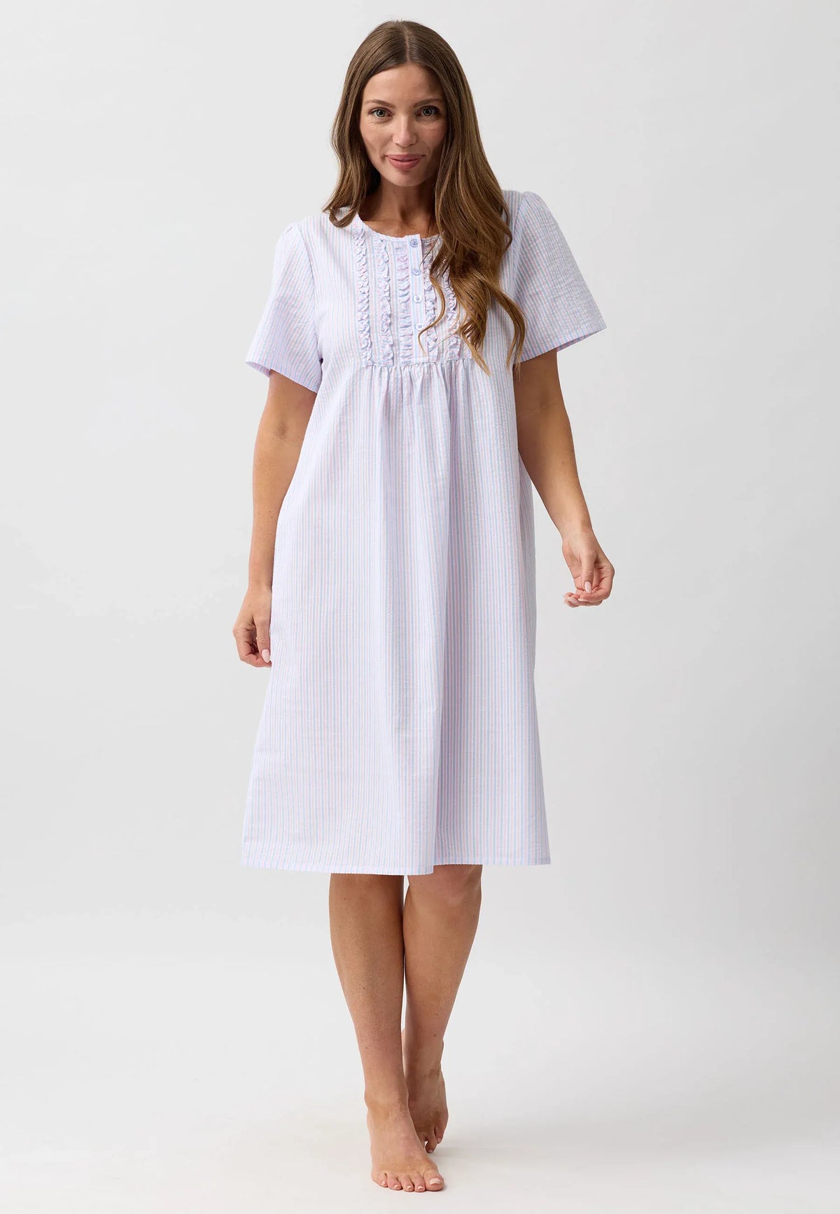 A soft light blue and white striped stripe nightie with short puffed sleeves and ruffled neckline detailing