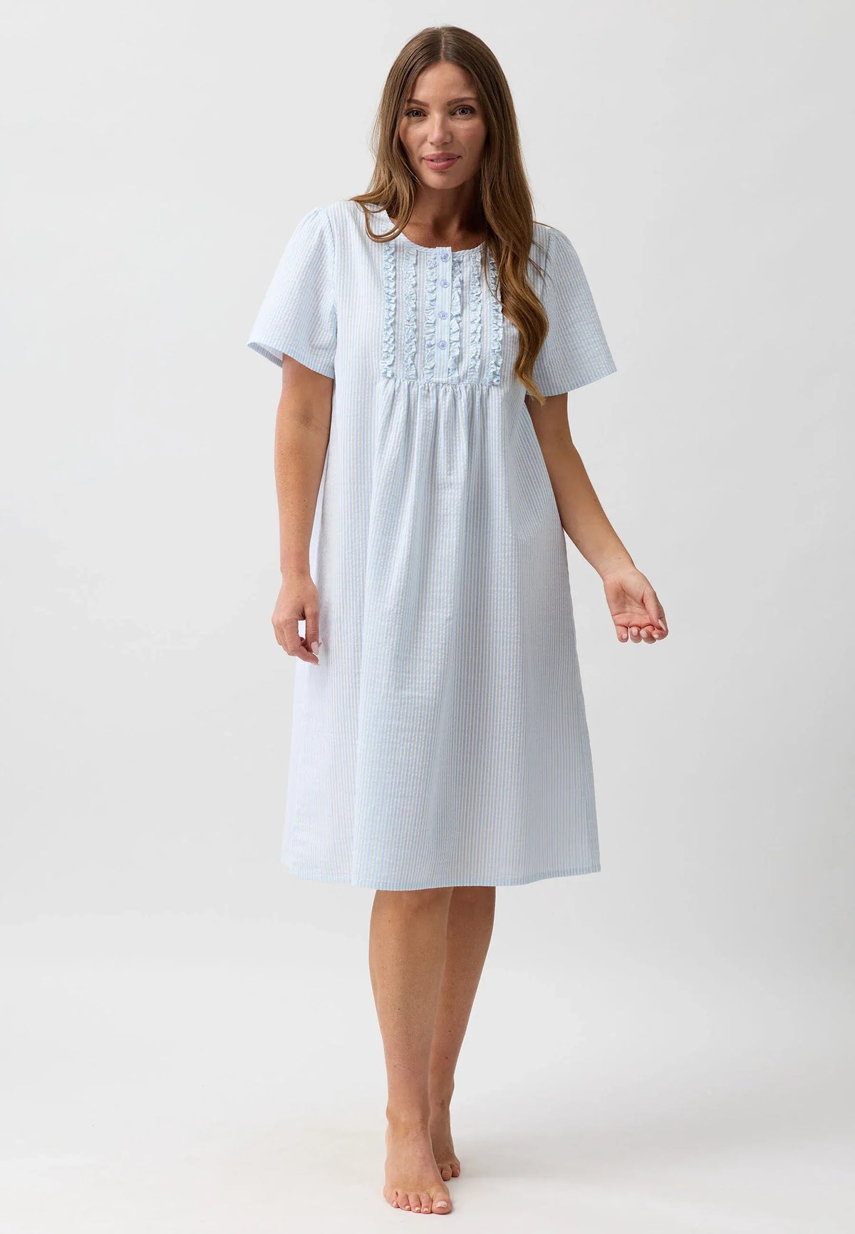 A light blue and white vertically striped nightie with short sleeves gathered waist and ruffled neckline embroidery