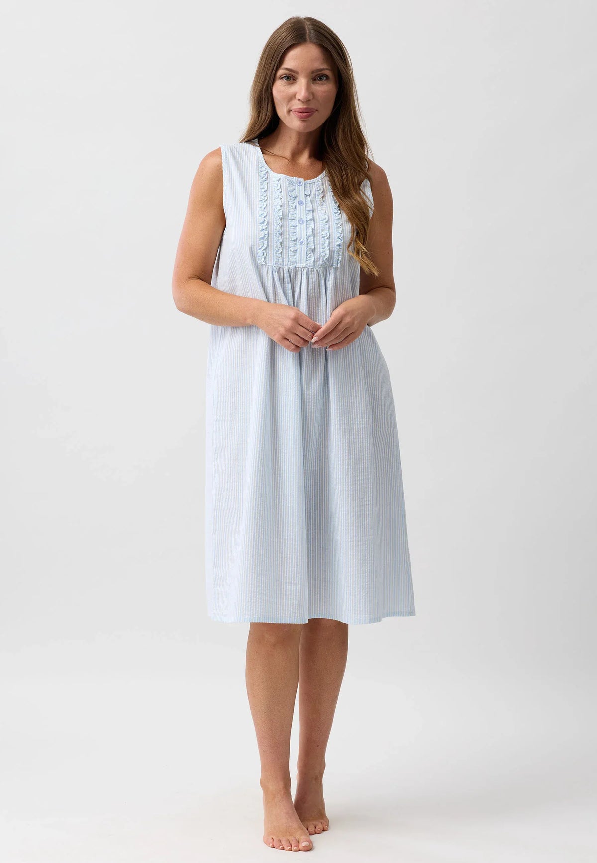 A light blue and white striped sleeveless nightie with delicate ruffled embroidery at the neckline