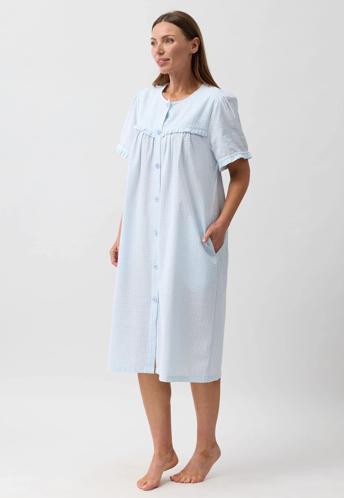 Stripe brunch coat nightgown in light blue and white vertical stripes with puffed sleeves and ruffled neckline