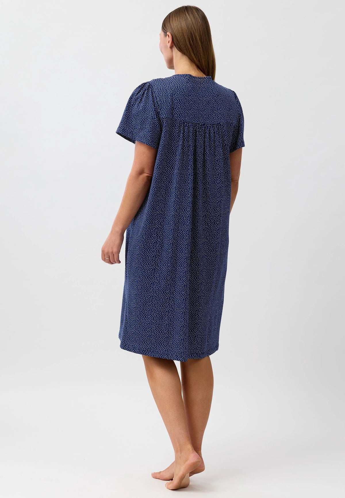 Confetti short sleeve nightie in navy blue with white polka dots, short puffed sleeves, and gathered waist