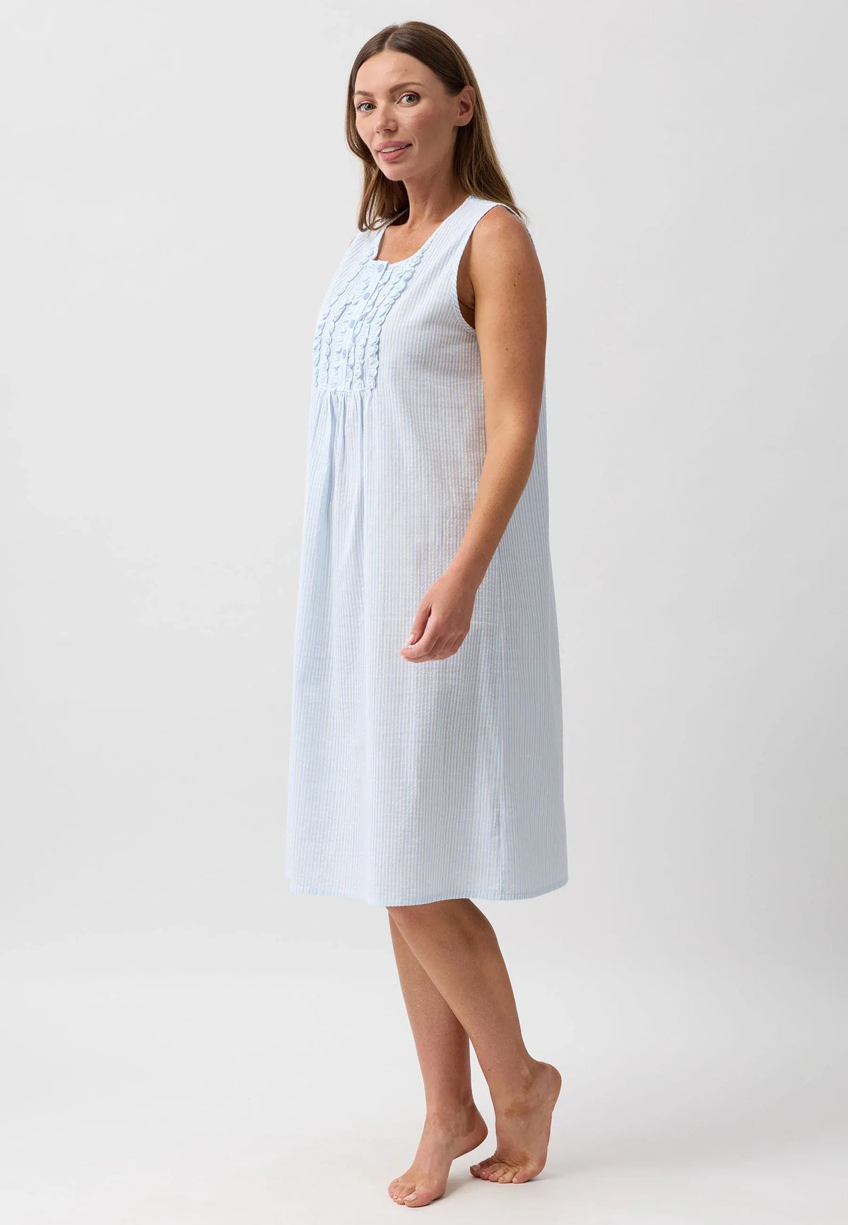 A light blue and white striped sleeveless nightie with delicate embroidery at the neckline for comfortable sleepwear