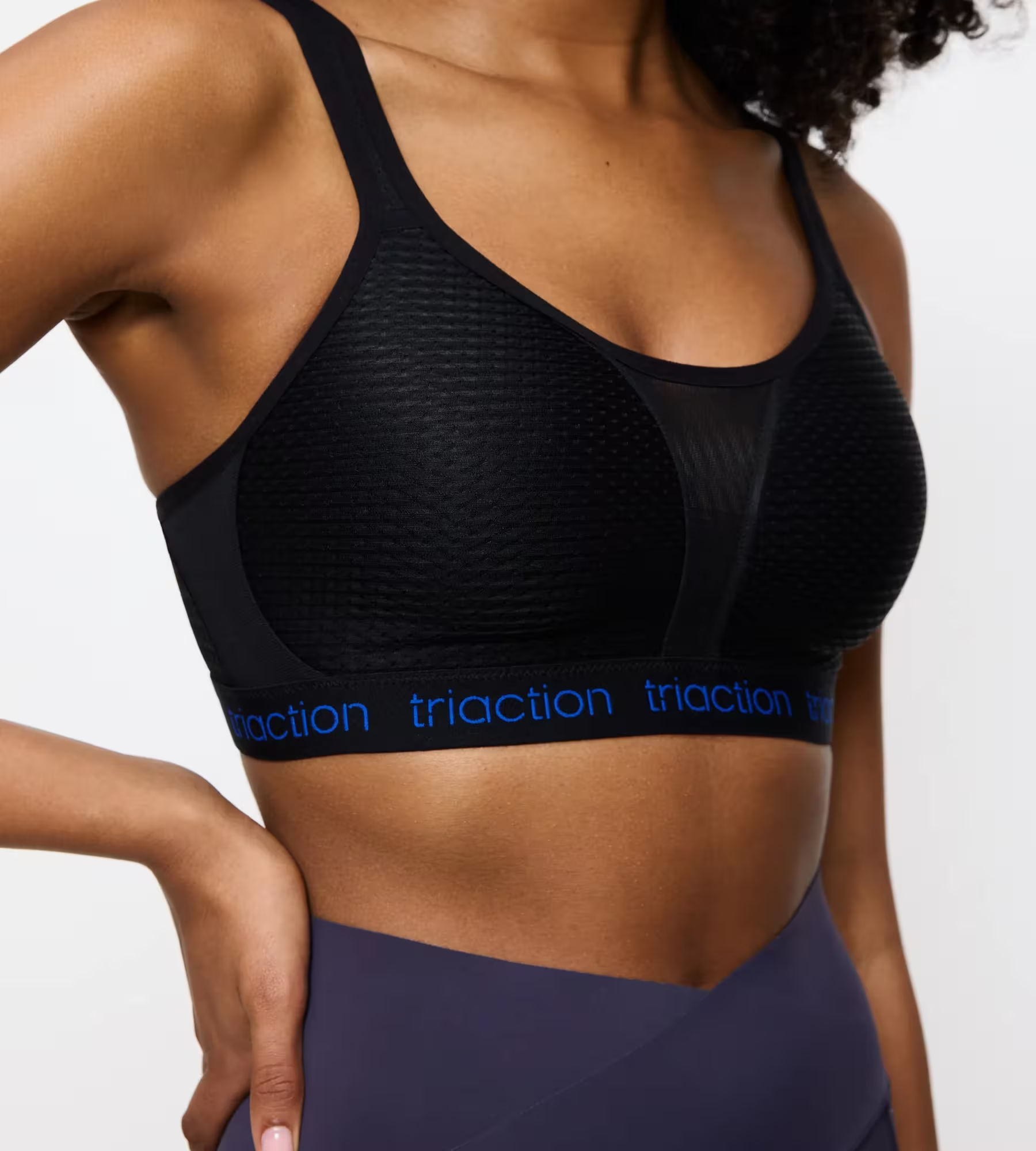 Black Triaction Energy Lite P EX athletic sports bra with textured fabric and blue branding