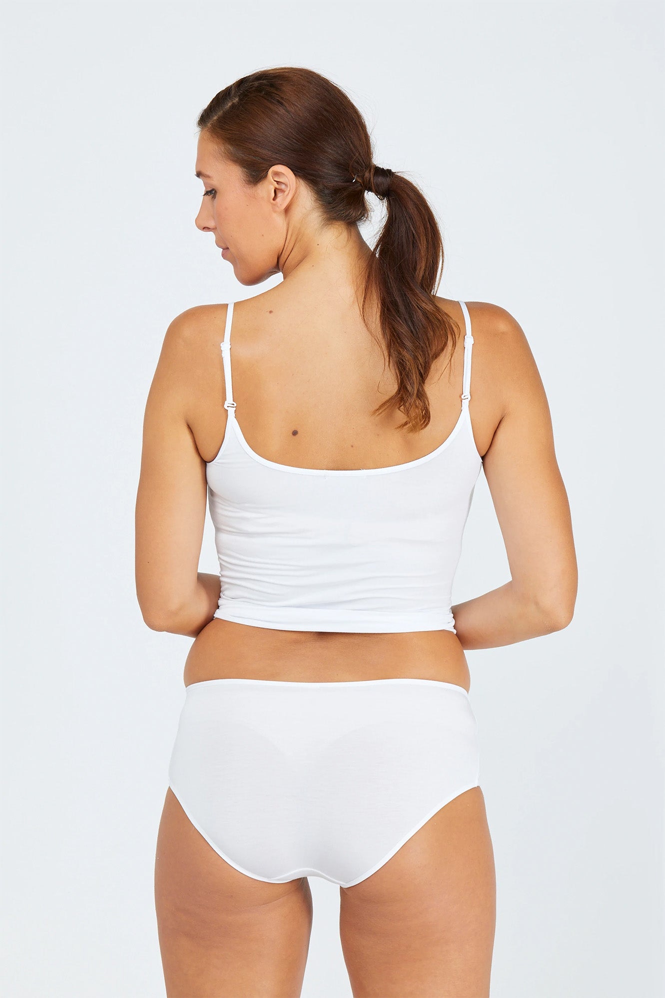 Woman wearing white tani 5984 Hipster Bikini back view