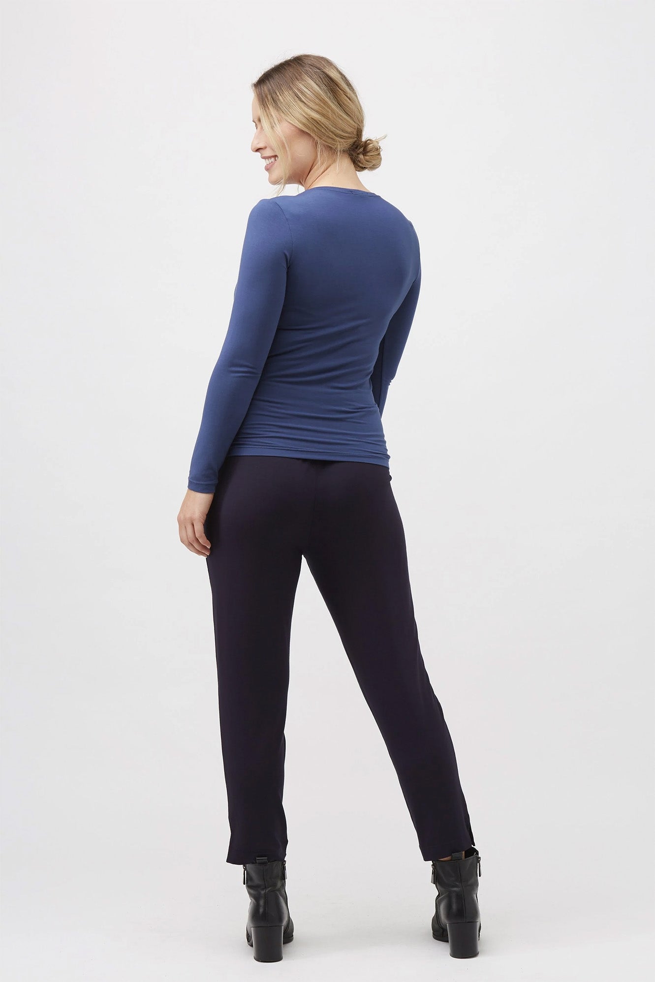 Woman wearing Tani 79276 High Neck Long Sleeve in adriatic back view
