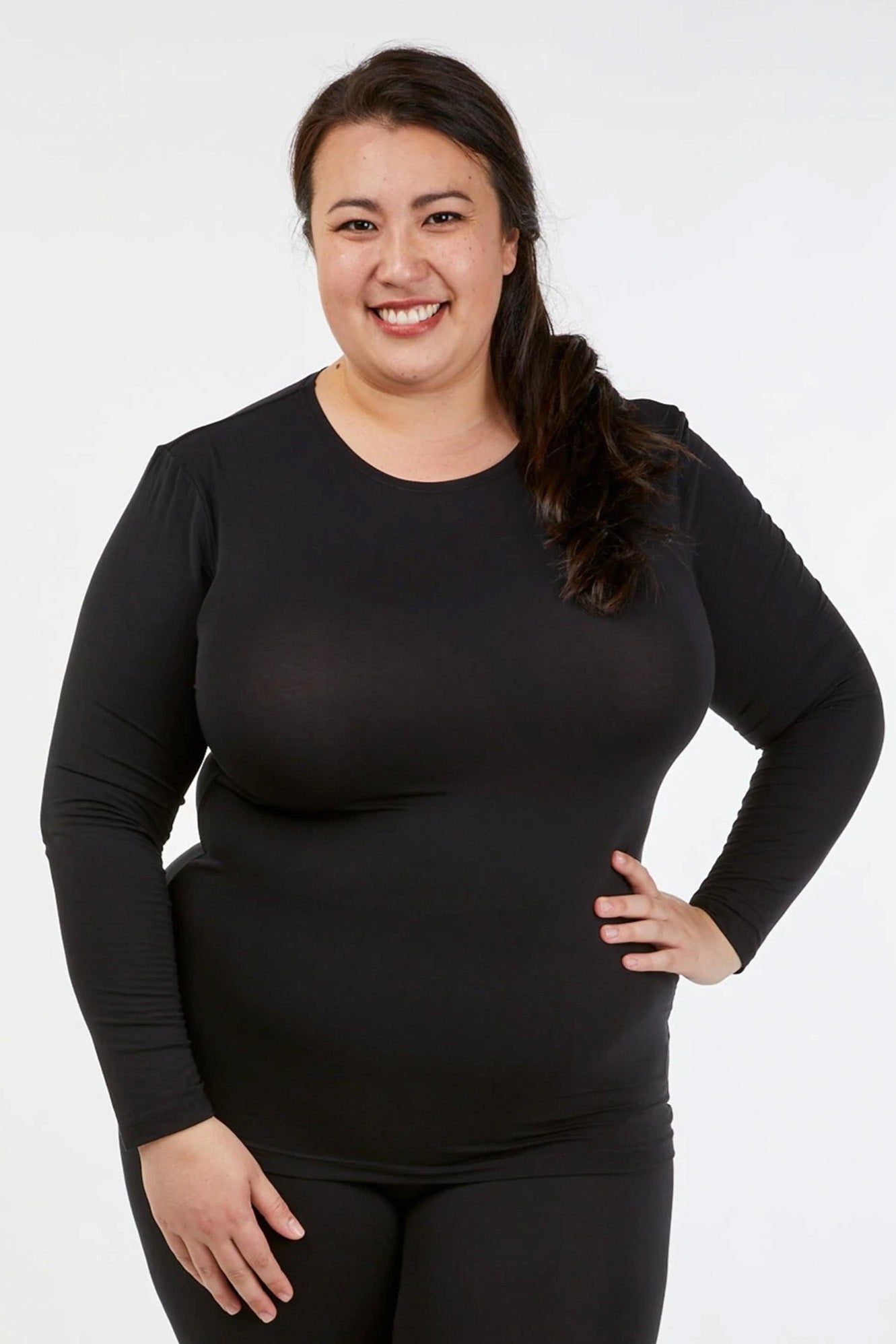 Full figure woman wearing Tani 79276 High Neck Long Sleeve in black
