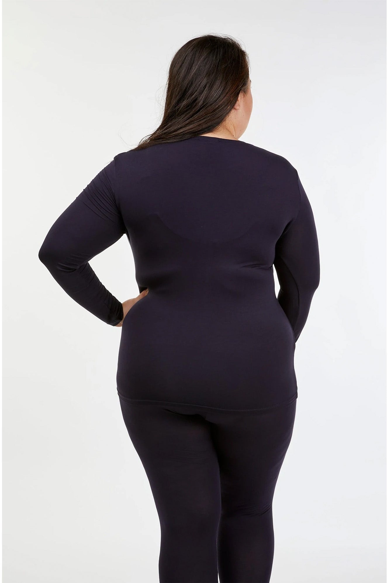Full figure woman wearing Tani 79276 High Neck Long Sleeve in French Navy back view