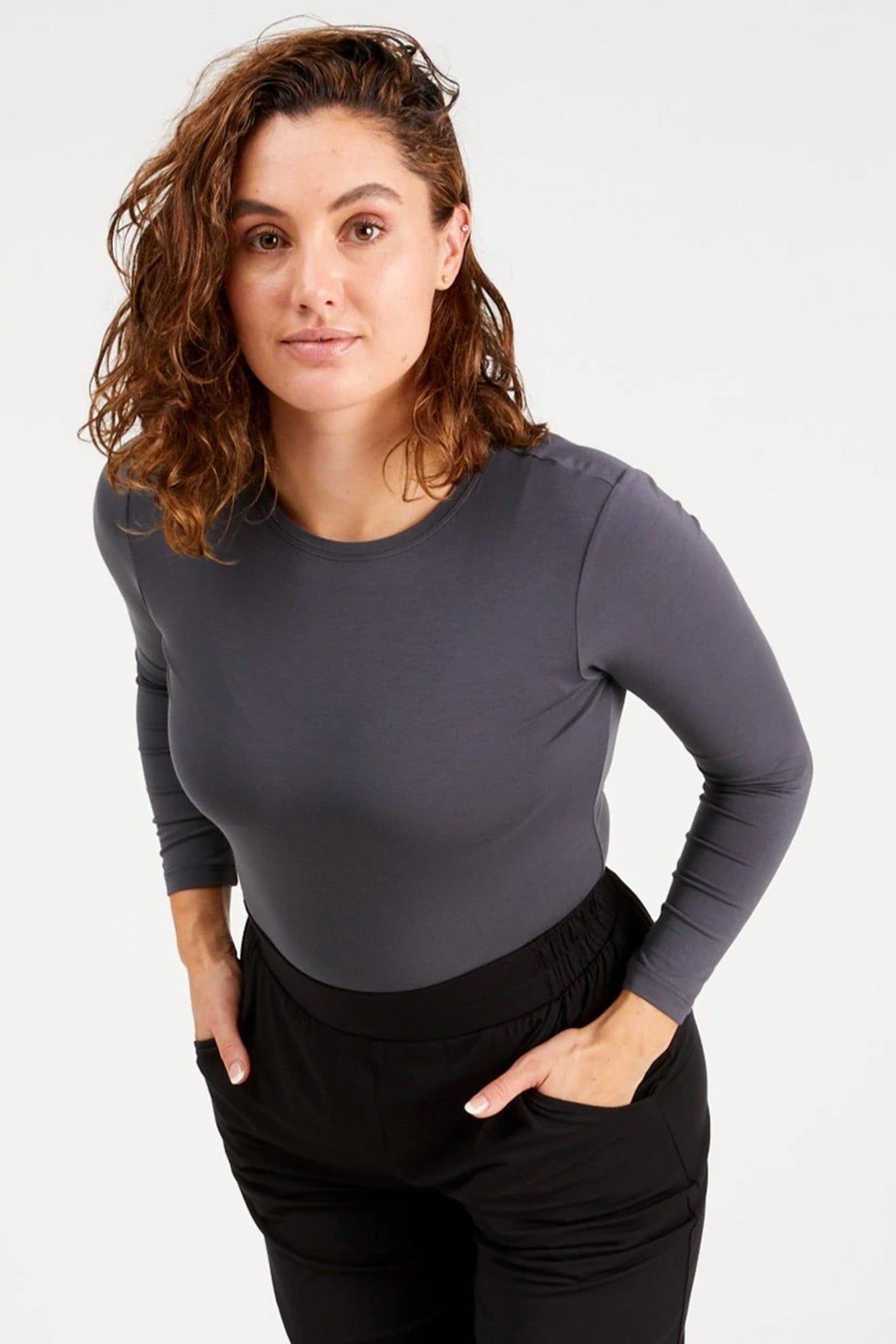 Young woman wearing Tani 79276 High Neck Long Sleeve in storm