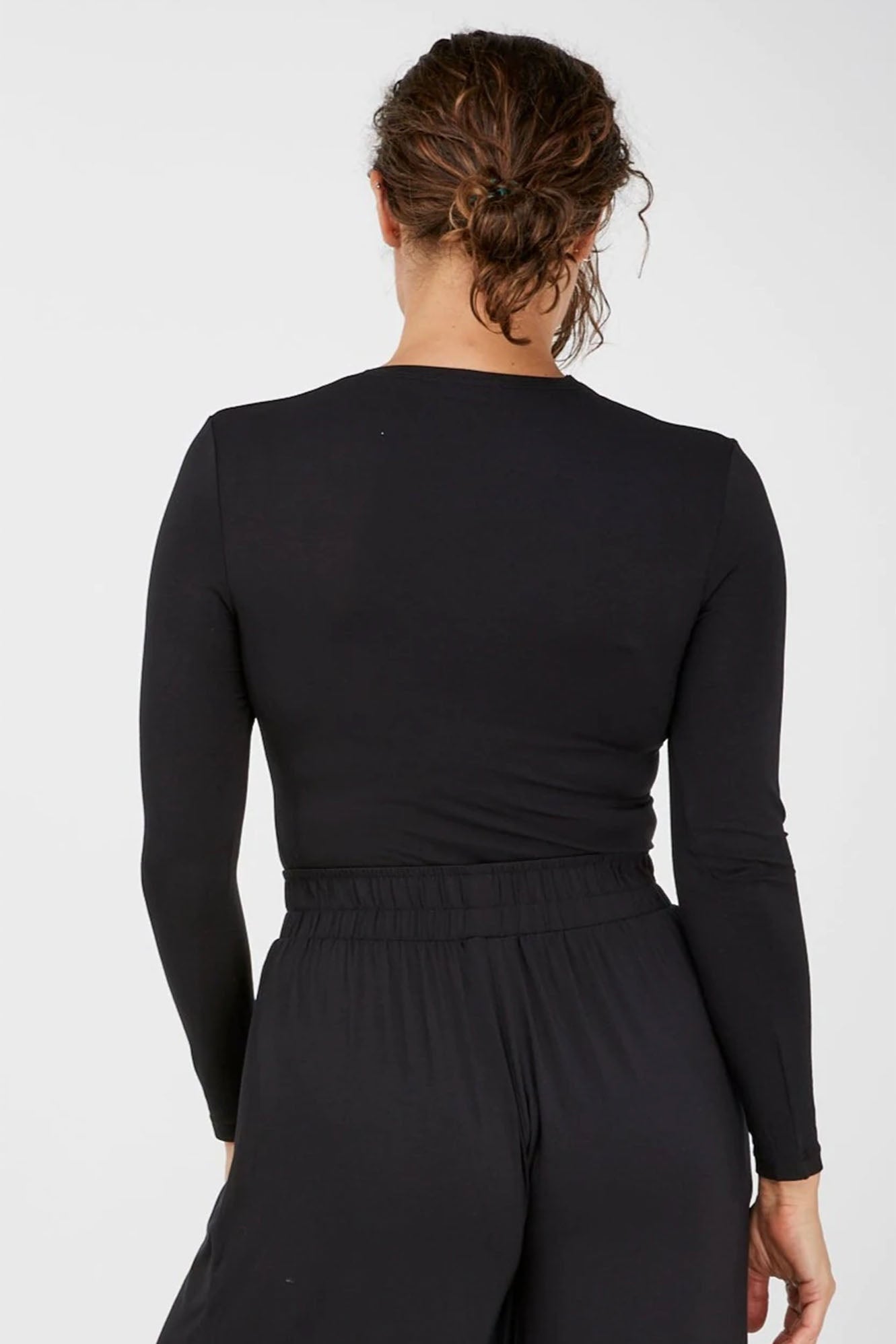 Woman wearing Black Tani Long Sleeve Scoop Neck Tee 79350 back view