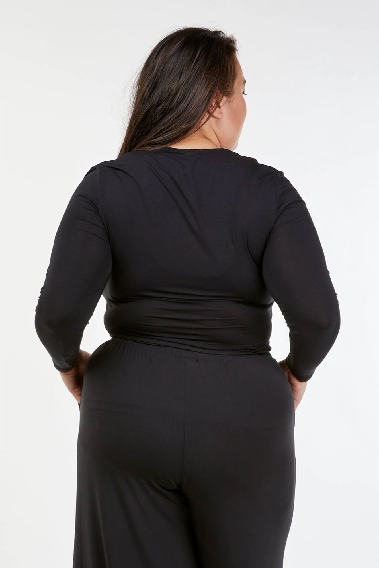 Woman wearing Black Tani Long Sleeve Scoop Neck Tee 79350 back view