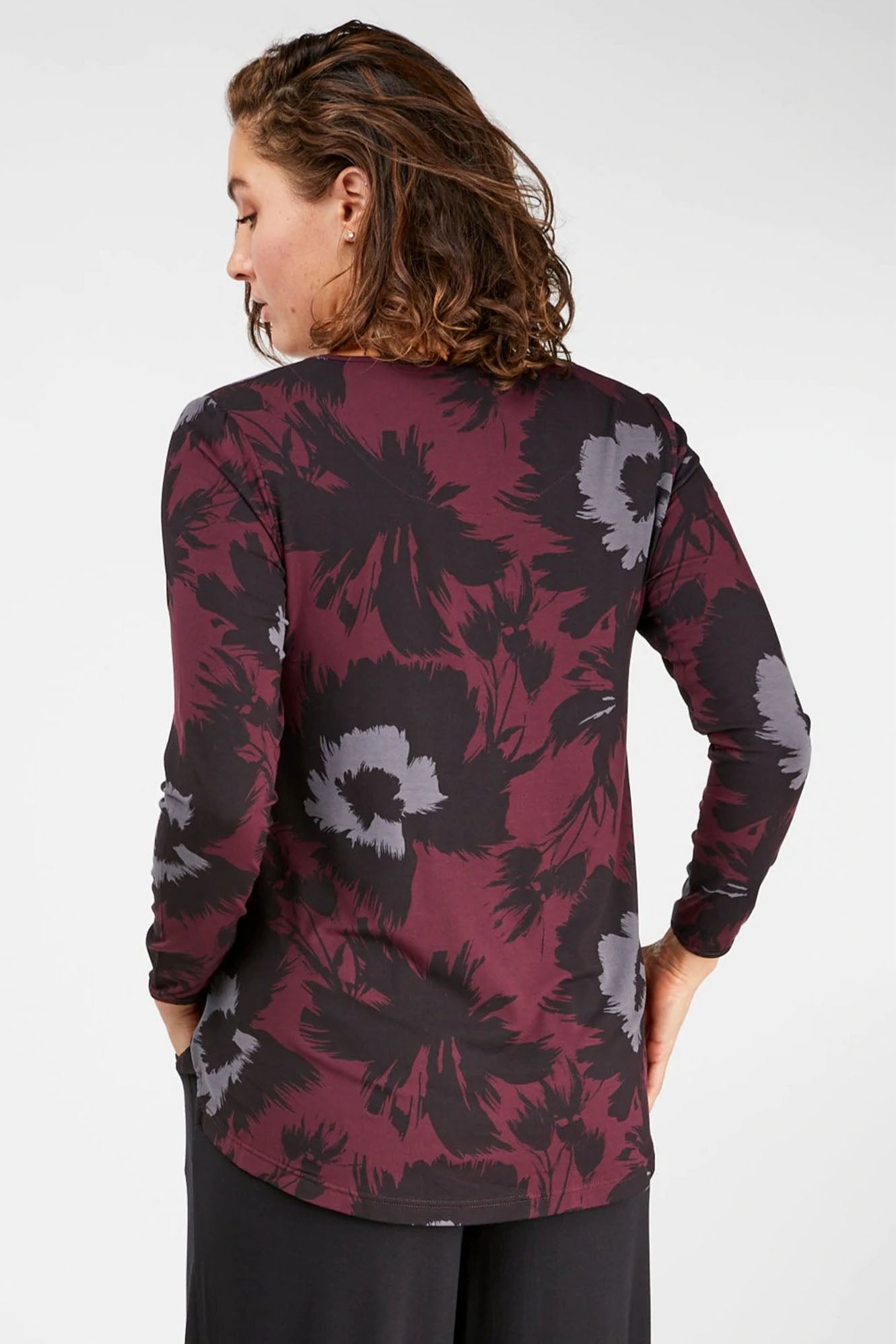 Woman wearing Tani Split Hem Relax Top 79410 in bloom print back view