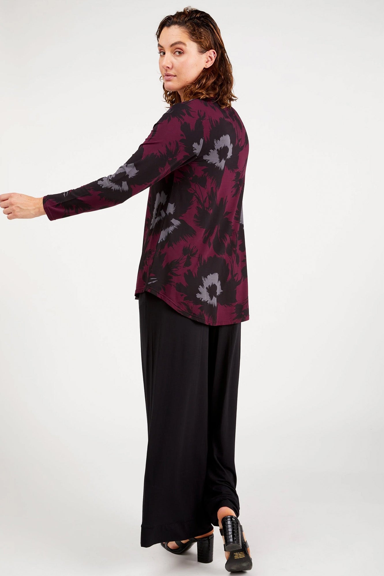 Young woman wearing Tani 79767 Cara Long Sleeve in Bloom Print back view