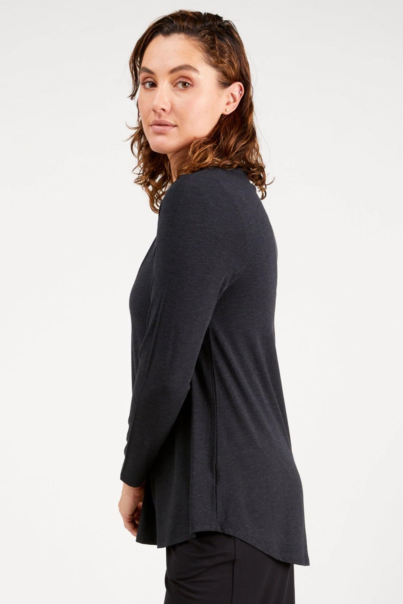 Young woman wearing Tani 79767 Cara Long Sleeve in Graphite side view